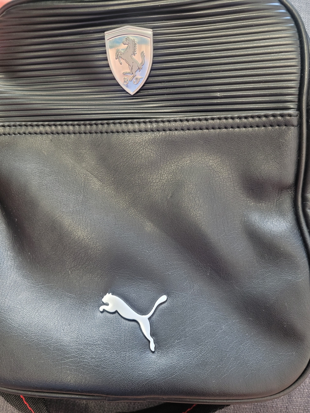 Puma Black Sling Backpack with Silver Puma Emblem and Shield Accent